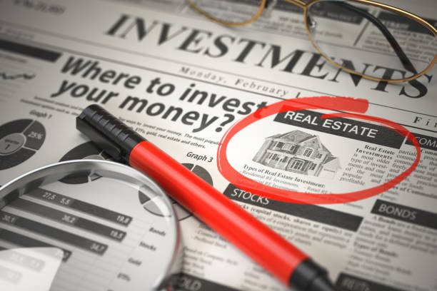 image0 Real Estate is a best option to invest. Where to Invest concept, Investmets newspaper with loupe and marker. 3d illustration